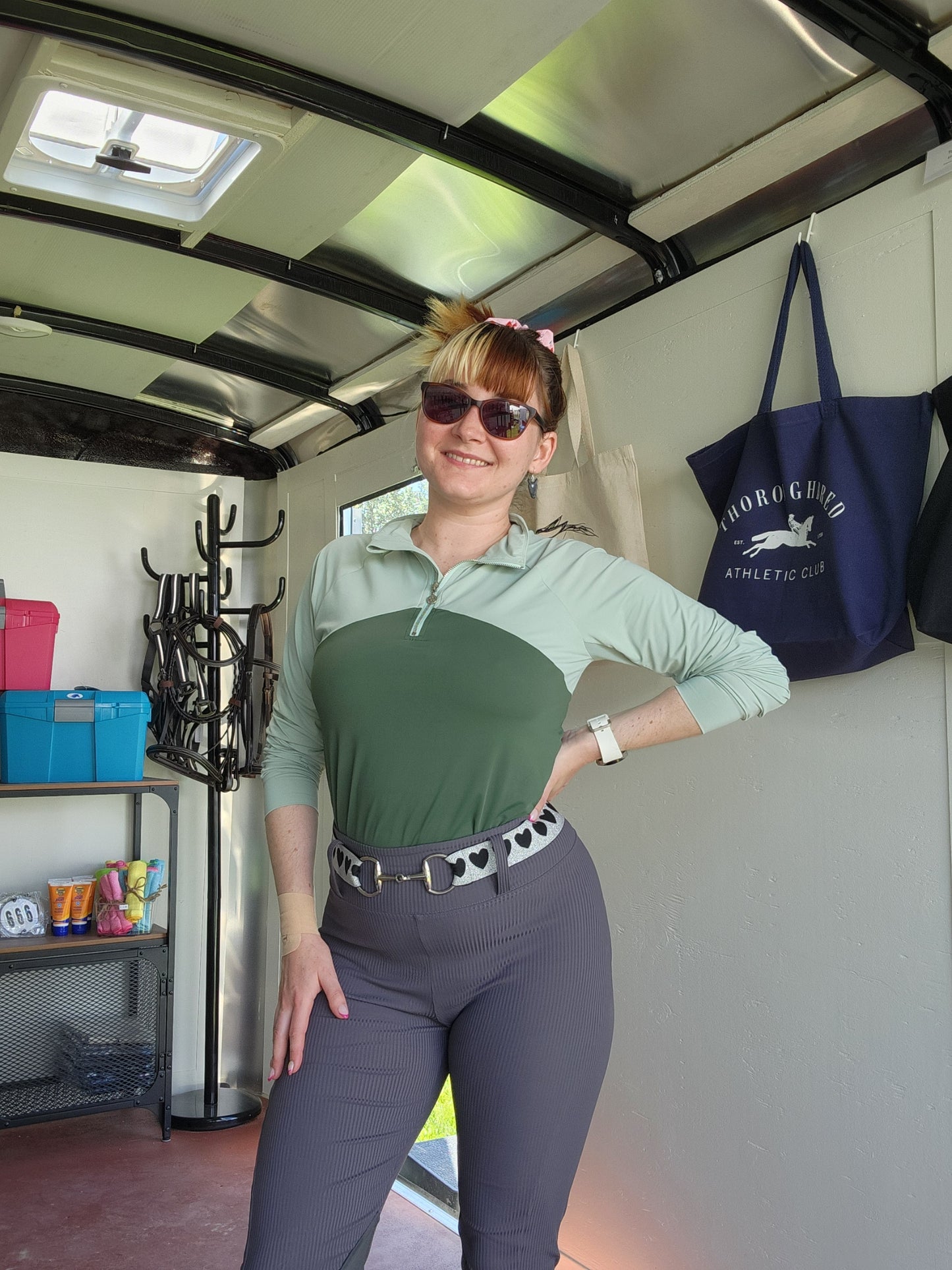Black stretch bit belt with glitter heart pattern, bold and playful for equestrian wear.