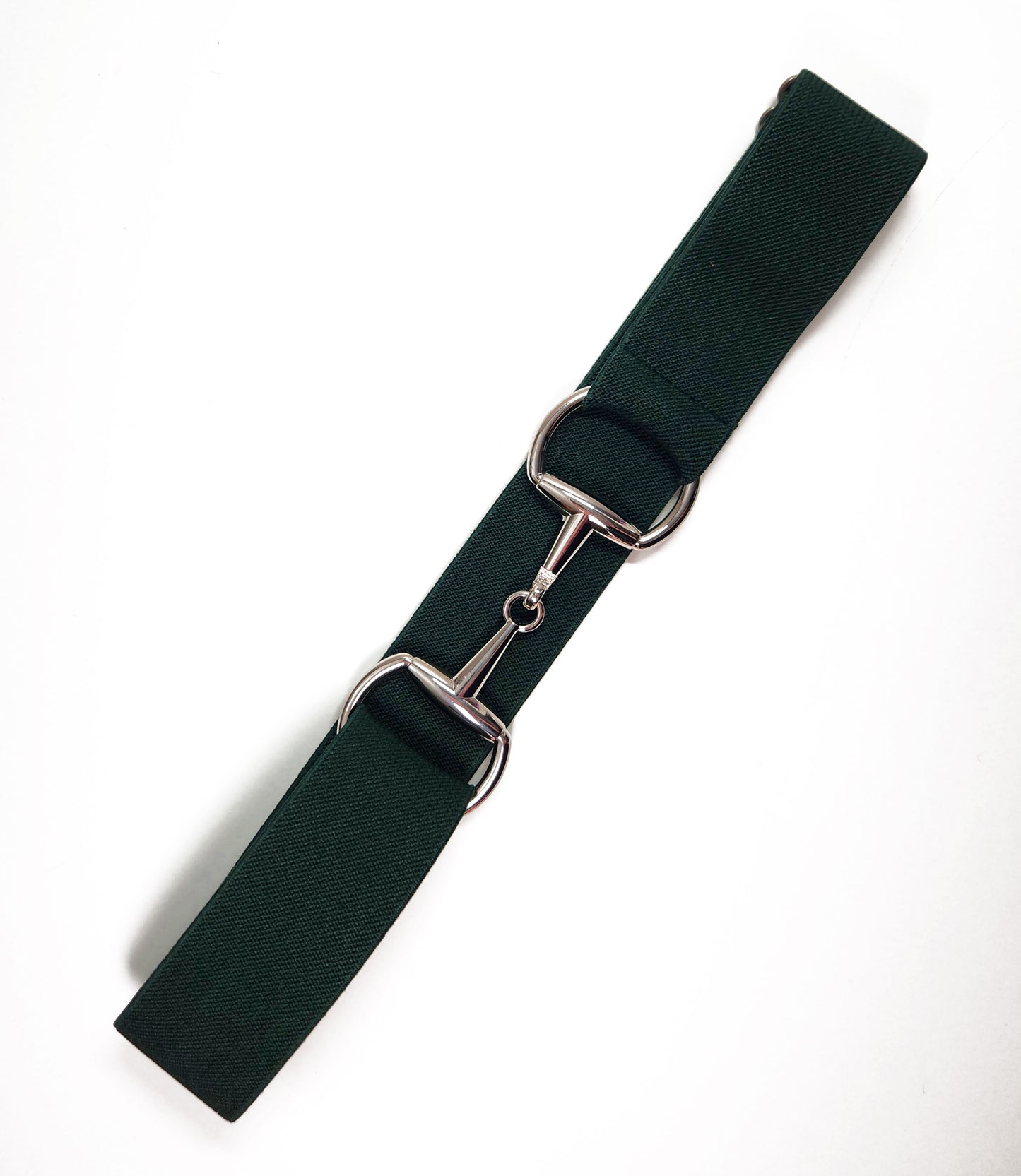 Hunter green stretch bit belt with silver clasp, subtle and stylish for equestrian outfits.