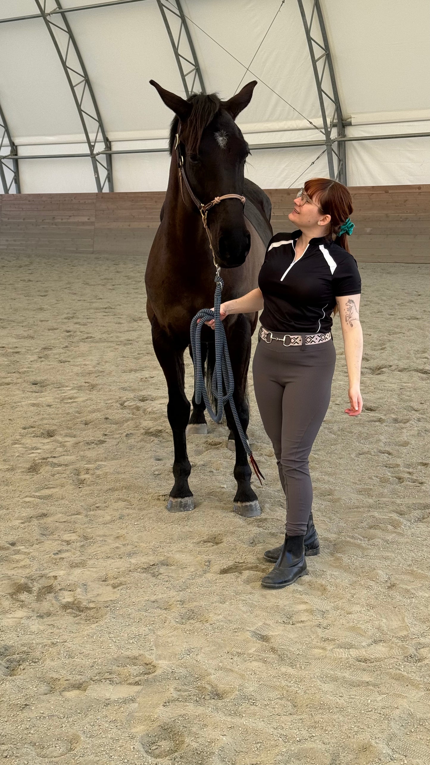 Pink and green diamond-pattern bit belt, vibrant accessory for riding or barn wear.